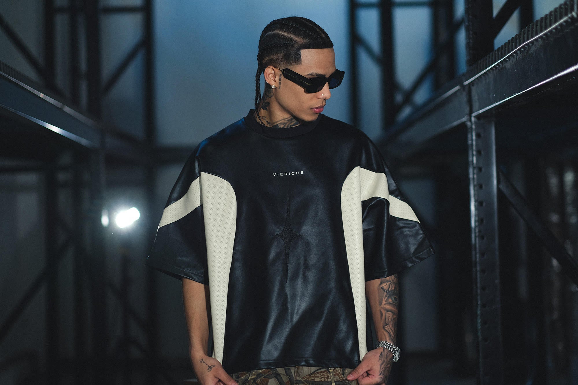Close-up of a man in a stylish shirt, showcasing urban streetwear essentials